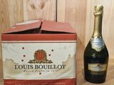a bottle of champagne and a bottle of wine on a table