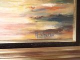 a picture of a painting of a sunset in a gold frame