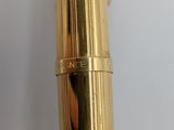 an image of a close up of a fountain pen on a white surface