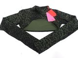 a black and green top with a pink heart on it
