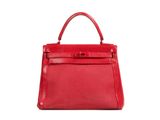 a red leather handbag on a white background