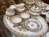 a display of china on a glass shelf in a store