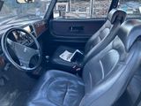 a picture of the inside of a car with leather seats