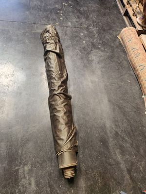 an umbrella that is laying on the floor in the room