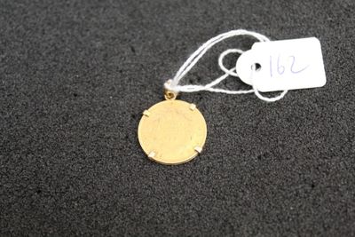 a close up of a gold coin with a price tag on it