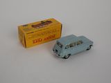 a small toy car next to a box of cigarettes