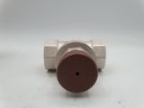 an image of a close up of a metal valve on a white surface