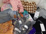 a pile of clothing that is sitting on the floor