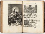 an open book with a picture of jesus on it