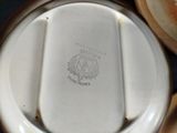 a close up of a white plate with a picture on it