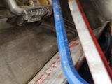 an image of a man working on a machine in a garage