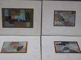 four framed paintings of different shapes and sizes on a white surface