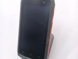 a cell phone that is sitting on top of a stand