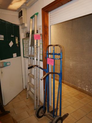 a hand truck that is sitting in the middle of a room