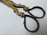 a close up of a pair of scissors on a table