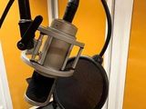 a microphone that is sitting on a stand in a room