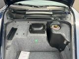 the trunk of a car with a speaker system in the trunk