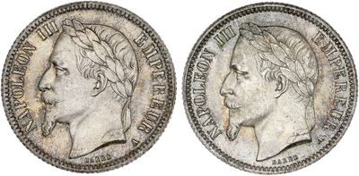 a silver coin with an image of a man ' s head on it