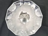 a clear glass bowl with a hole in it