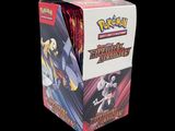 the box is full of pokemon trading cards on a black background