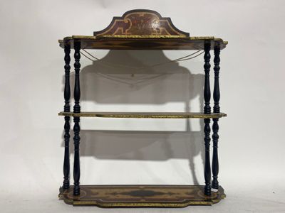 an old wooden shelf with a clock on top of it