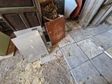 a pile of junk on the floor in a room