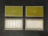 three boxed silverplated cigarette cases and a box of cigarettes