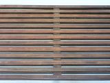 a wooden bench that is made of wood slats