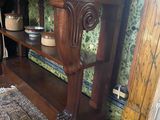 a wooden table with a shelf on top of it