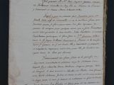 an old document with writing on it sitting on top of a table