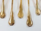 five spoons and six spoons on a white table