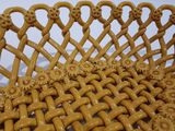 a wicker basket that has a bunch of flowers on it