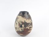 a vase that has a picture of a horse drawn carriage on it
