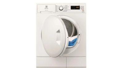 un gros plan d'une machine à laver dont la porte est ouverte