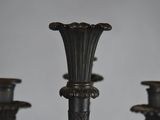 pair of antique bronze candlesticks with a black patt finish