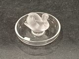 a glass object that is sitting on a black surface