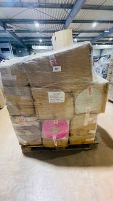 a large stack of boxes sitting on a pallet in a warehouse