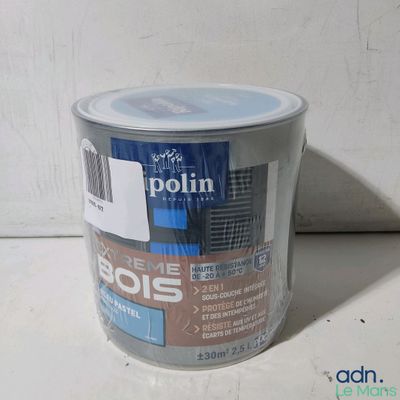 a can of paint that is sitting on a table