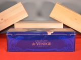 a blue box with two wooden boxes on top of it