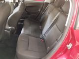 a red car with black seats in the back of it