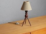 a lamp that is sitting on top of a dresser