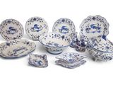 blue and white porcelain dishes and bowls with blue flowers on them