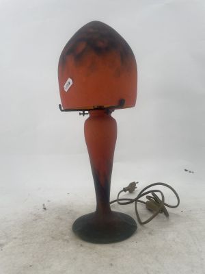 a lamp that is sitting on the ground in the snow