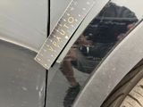 a sticker on the side of a car that has a ruler on it