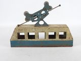 a toy bus with a gun on top of it