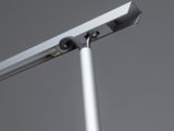 a close up of a metal pole with a light on top of it