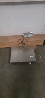 an image of a scale sitting on the floor in a room