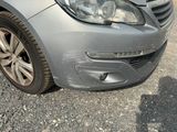 an image of a car that has been dented and is parked on the side of the road