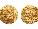 two gold coins with arabic writing on them