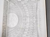 an open book with a drawing of a city in the middle